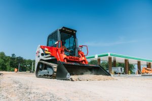 Takeuchi TL11R3 compact track loader with radial lift boom, enclosed cab, touchscreen display, and heavy-duty design for grading and dirt work